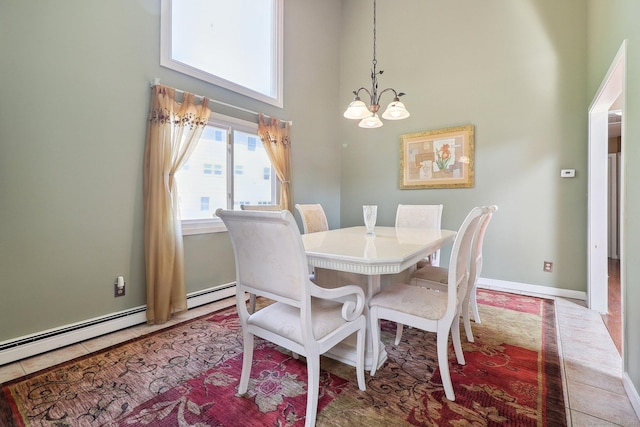 46 Fairway Grn, Fairfield, CT 06825 - dining room with a chandelier, a baseboard radiator, and a high ceiling