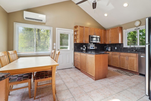 46 Fairway Grn, Fairfield, CT 06825 - kitchen with stainless steel appliances, open shelves, ceiling fan, a wall mounted AC, and decorative backsplash