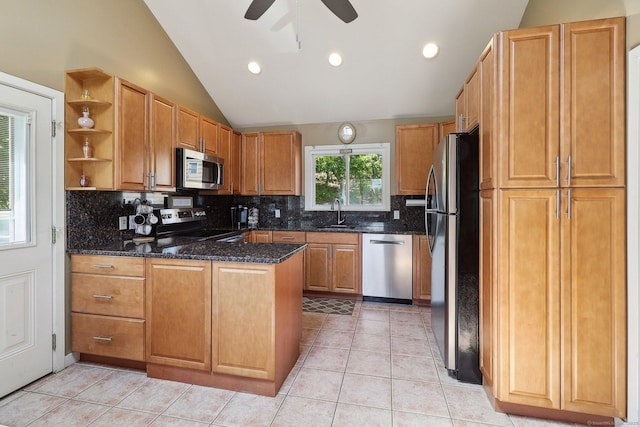 46 Fairway Grn, Fairfield, CT 06825 - kitchen featuring a peninsula, stainless steel appliances, tasteful backsplash, vaulted ceiling, and ceiling fan