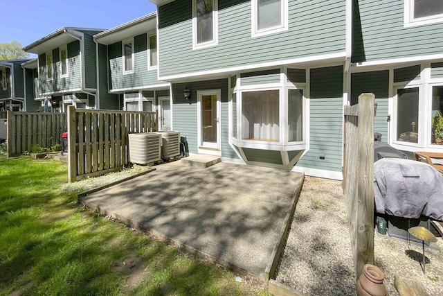 back of property featuring a patio and cooling unit