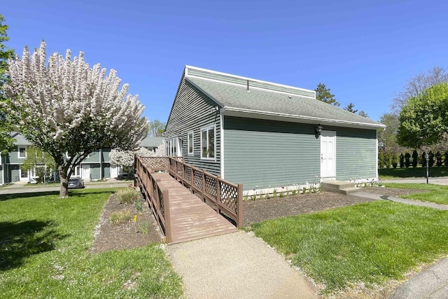 view of side of property featuring a yard