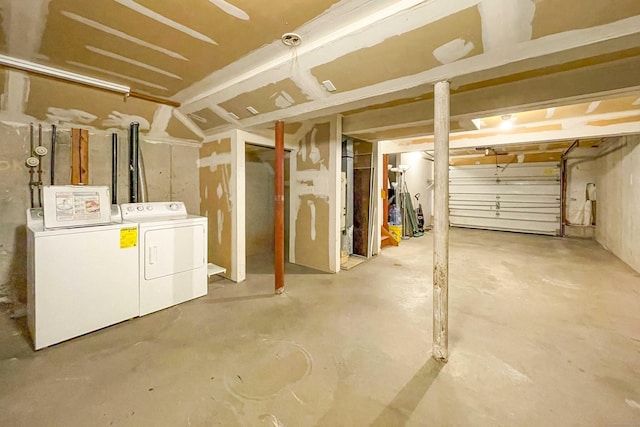 unfinished basement featuring separate washer and dryer