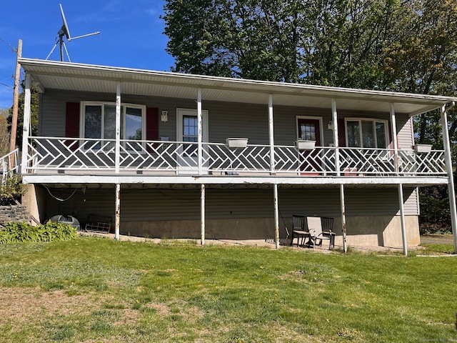 back of house featuring a yard and a porch