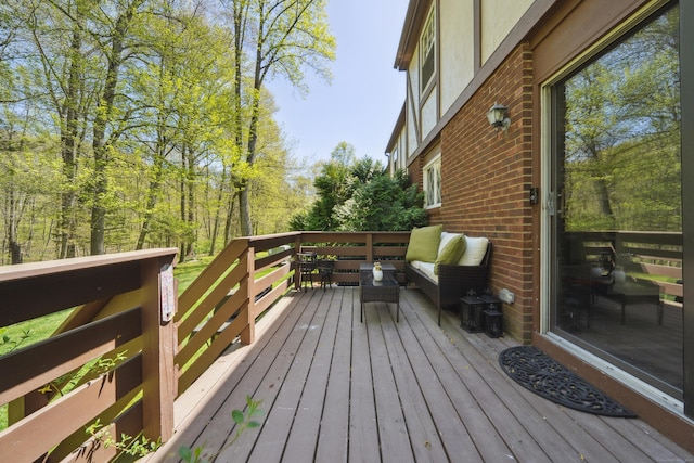 wooden deck featuring an outdoor hangout area