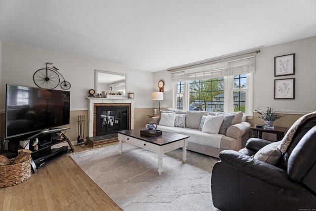 living area featuring a fireplace and wood finished floors