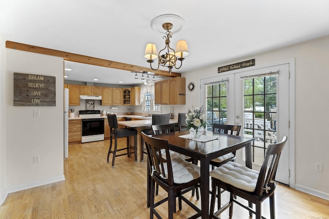 dining area featuring a chandelier, recessed lighting, baseboards, and light wood-style floors