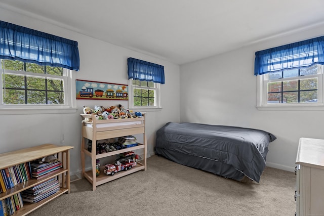 carpeted bedroom with baseboards