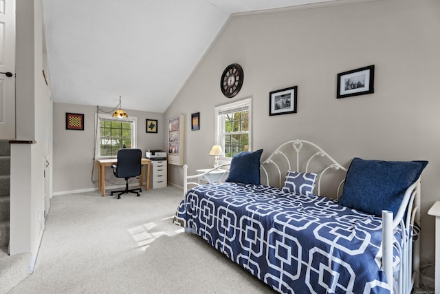 carpeted bedroom with vaulted ceiling and baseboards