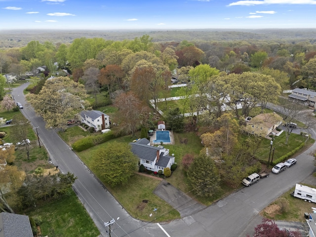 aerial view featuring a wooded view