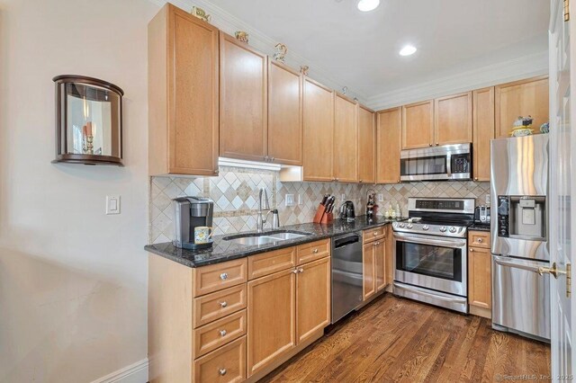 44 Woodcrest Ln Unit 44, Danbury, CT 06810 - kitchen with appliances with stainless steel finishes, decorative backsplash, dark stone countertops, dark wood-style floors, and recessed lighting