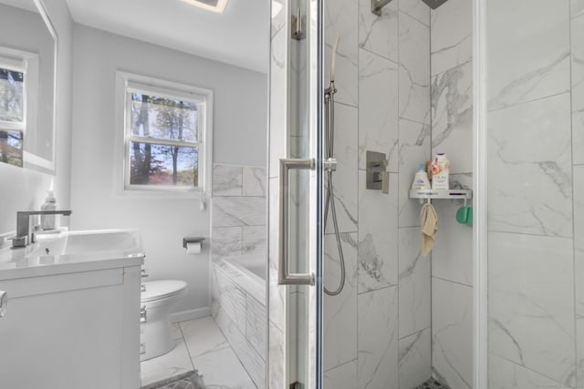 full bathroom with a tub, vanity, toilet, marble finish floor, and a marble finish shower