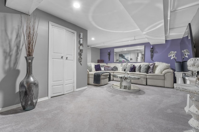 living room with carpet floors, recessed lighting, and baseboards