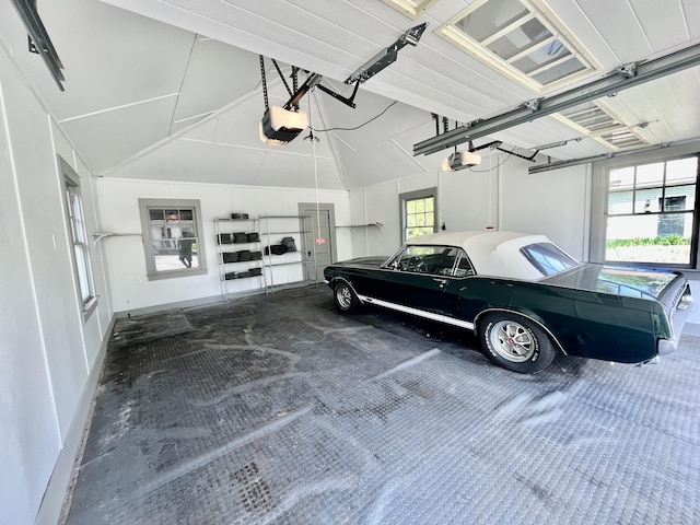 garage featuring baseboards and a garage door opener