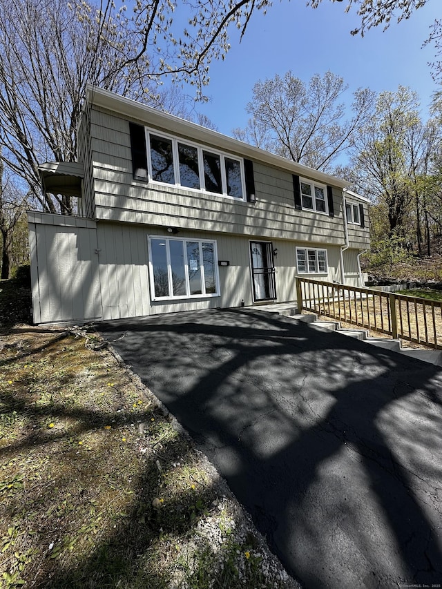 163 Sylvan Ave, Waterbury, CT 06706 - view of front of property featuring asphalt driveway and a patio area