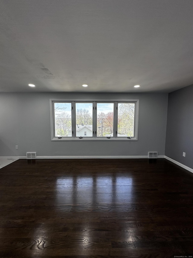 163 Sylvan Ave, Waterbury, CT 06706 - empty room with dark wood-style floors and recessed lighting