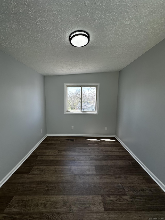 163 Sylvan Ave, Waterbury, CT 06706 - unfurnished room featuring dark wood-style flooring and a textured ceiling