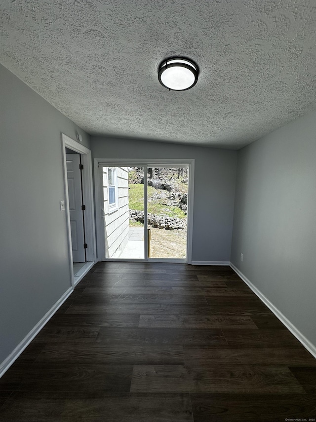 163 Sylvan Ave, Waterbury, CT 06706 - empty room featuring a textured ceiling and dark wood-type flooring