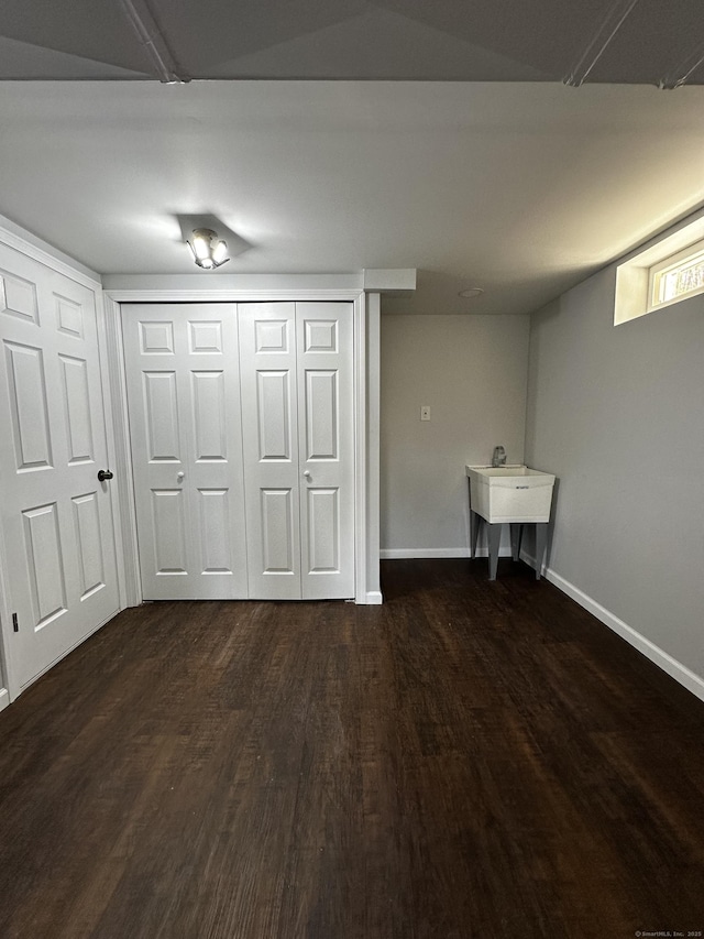 163 Sylvan Ave, Waterbury, CT 06706 - finished below grade area featuring dark wood finished floors and baseboards