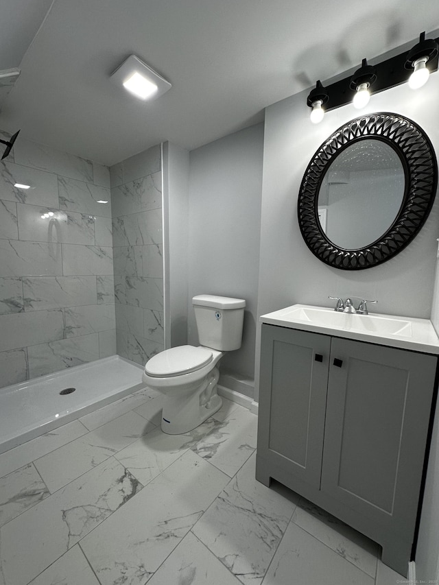 163 Sylvan Ave, Waterbury, CT 06706 - full bath with marble look tile flooring, vanity, and a tile shower