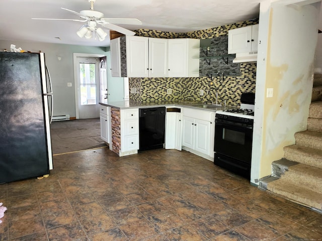 kitchen with range with gas cooktop, a sink, freestanding refrigerator, black dishwasher, and white cabinetry