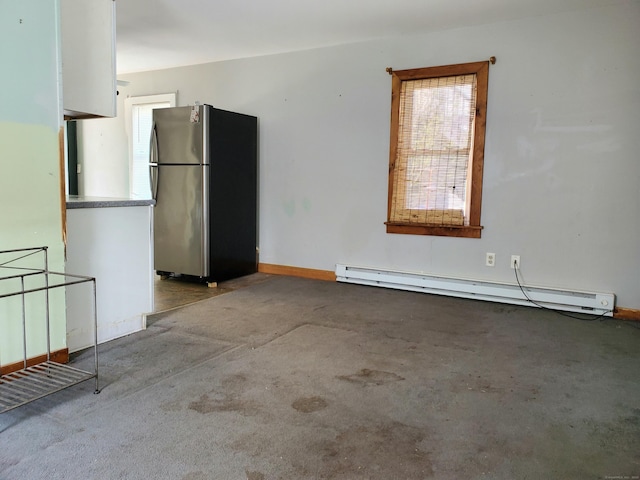 interior space featuring carpet floors, baseboards, and baseboard heating