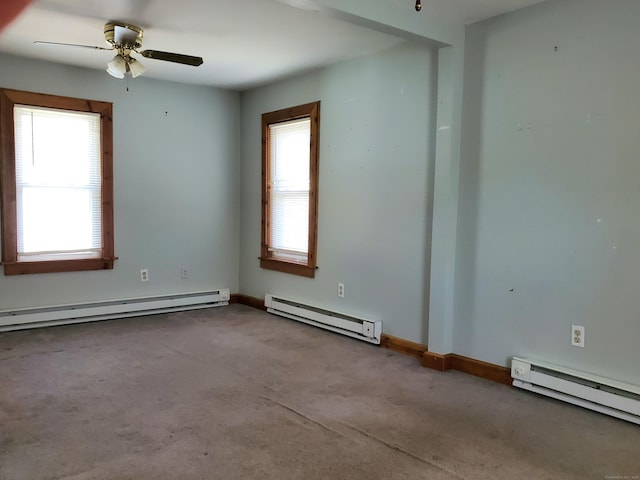 unfurnished room with carpet floors and a baseboard radiator