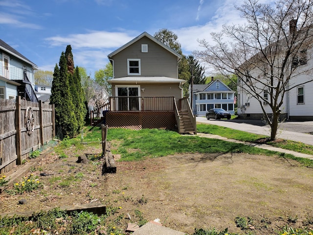 back of house featuring stairway, fence, and a wooden deck