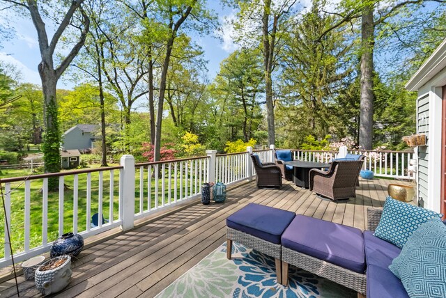 deck featuring view of scattered trees