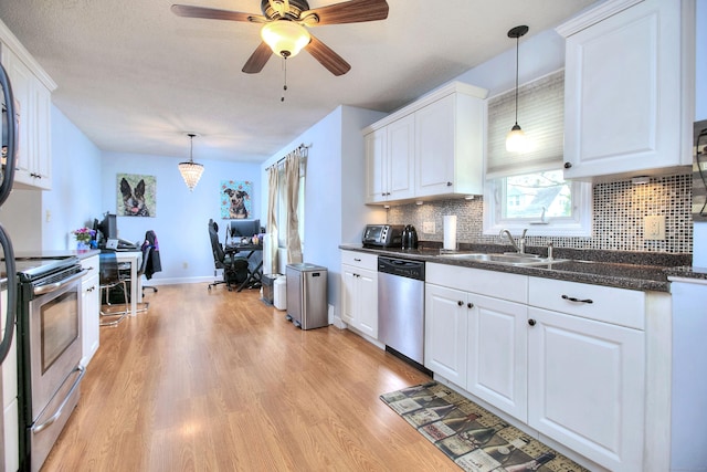116 Hill St Unit 23, Milford, CT 06460 - kitchen featuring white cabinets, appliances with stainless steel finishes, a sink, light wood-type flooring, and backsplash