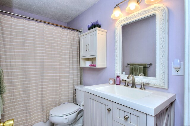 116 Hill St Unit 23, Milford, CT 06460 - bathroom with toilet, a textured ceiling, a shower with shower curtain, and vanity