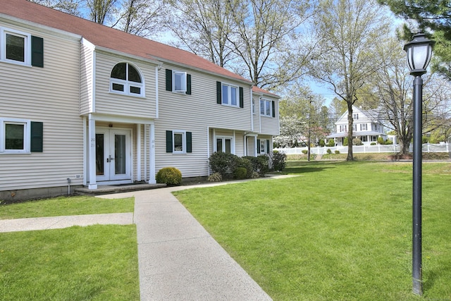 116 Hill St Unit 23, Milford, CT 06460 - view of front facade featuring french doors and a front yard