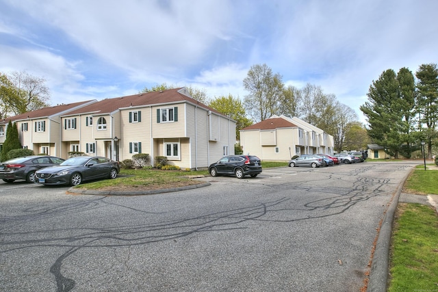 116 Hill St Unit 23, Milford, CT 06460 - view of front of house featuring uncovered parking and a residential view