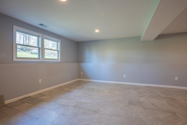empty room with recessed lighting and baseboards