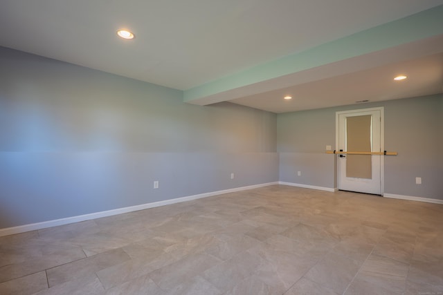 empty room with recessed lighting and baseboards
