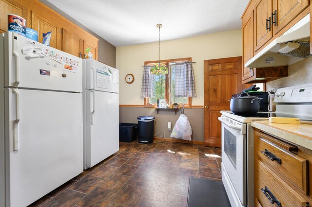 461 Meriden Waterbury Tpke, Southington, CT 06489 - kitchen featuring brown cabinetry, stone finish flooring, light countertops, under cabinet range hood, and white appliances