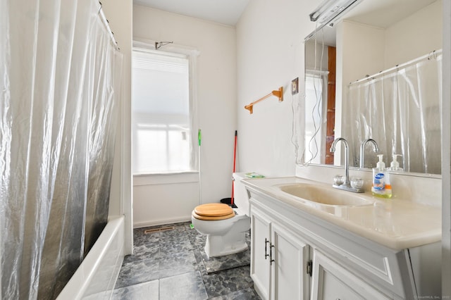 full bathroom with vanity, toilet, and shower / tub combo with curtain