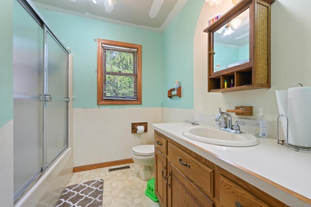 461 Meriden Waterbury Tpke, Southington, CT 06489 - full bath with visible vents, vanity, baseboards, toilet, and enclosed tub / shower combo