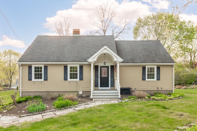 123 Hilltop Dr, Trumbull, CT 06611 - new england style home with a chimney, a shingled roof, and a front lawn