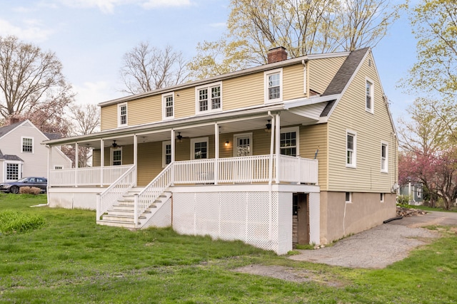 123 Hilltop Dr, Trumbull, CT 06611 - view of front of house with a ceiling fan, covered porch, a chimney, and a front yard