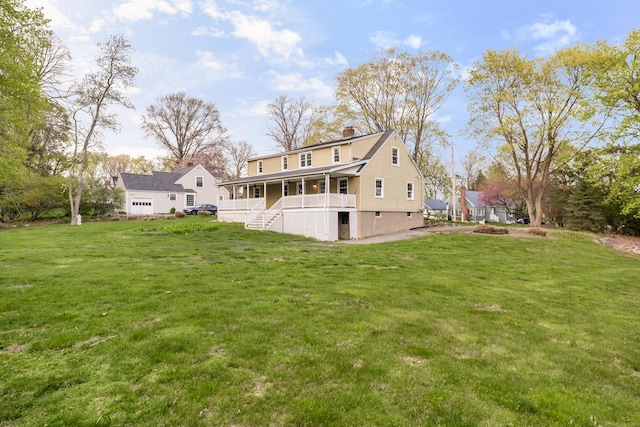 123 Hilltop Dr, Trumbull, CT 06611 - back of house with a porch, a yard, and a chimney