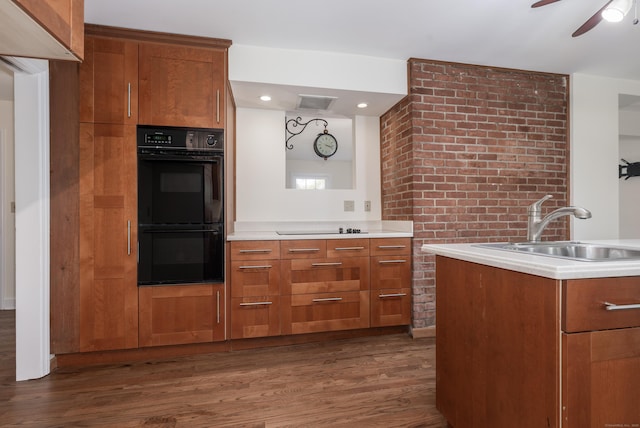123 Hilltop Dr, Trumbull, CT 06611 - kitchen featuring ceiling fan, dark wood finished floors, a sink, light countertops, and black appliances