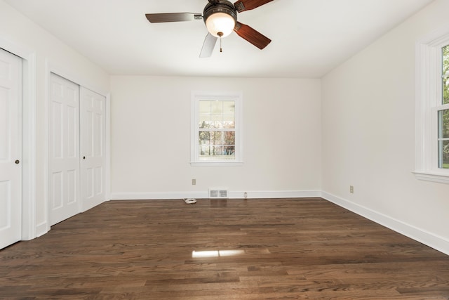 123 Hilltop Dr, Trumbull, CT 06611 - unfurnished bedroom with multiple closets, baseboards, dark wood-style flooring, and visible vents
