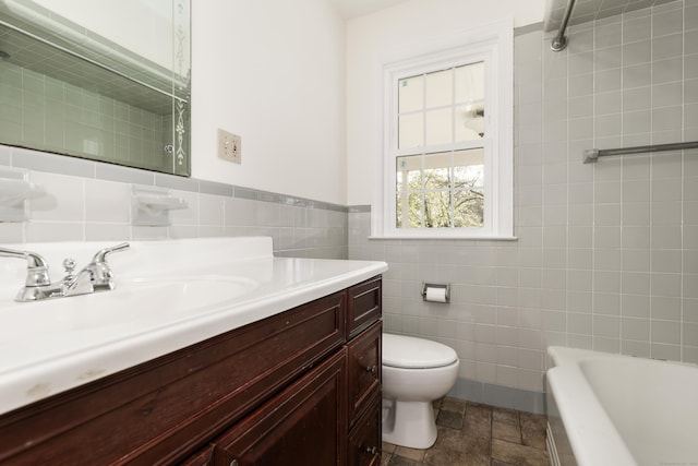 123 Hilltop Dr, Trumbull, CT 06611 - full bath with vanity, toilet, stone finish floor, tile walls, and a bath