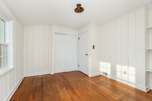 123 Hilltop Dr, Trumbull, CT 06611 - unfurnished bedroom featuring wood-type flooring, visible vents, and a closet