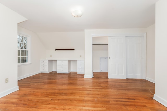 123 Hilltop Dr, Trumbull, CT 06611 - interior space featuring baseboards, a closet, light wood finished floors, and lofted ceiling