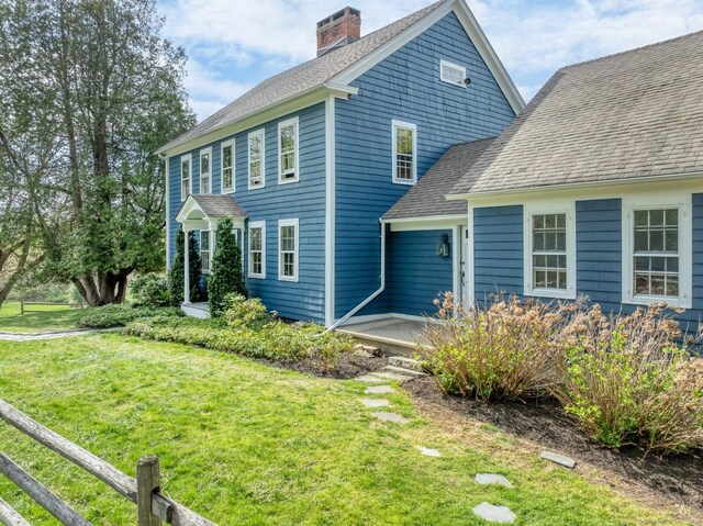149 Limekiln Rd, Redding, CT 06896 - view of front facade with a chimney, a front lawn, and a shingled roof
