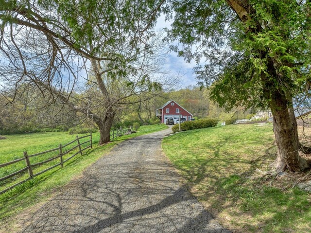 149 Limekiln Rd, Redding, CT 06896 - view of asphalt driveway with a barn and a wooded view