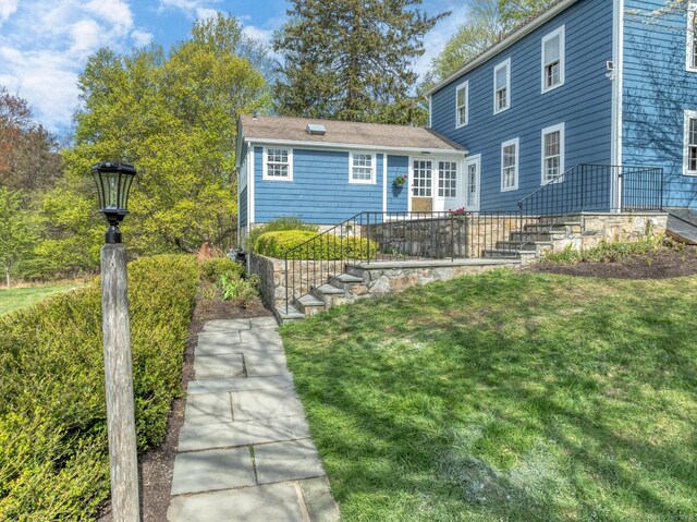 149 Limekiln Rd, Redding, CT 06896 - back of property with stairway and a lawn