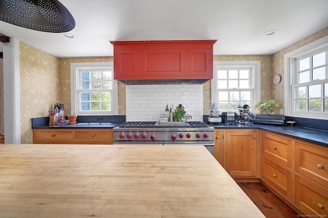 149 Limekiln Rd, Redding, CT 06896 - kitchen featuring range with two ovens, wood counters, wood finished floors, wallpapered walls, and backsplash