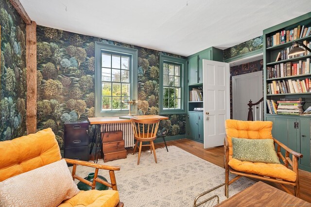 149 Limekiln Rd, Redding, CT 06896 - sitting room with wallpapered walls, wood finished floors, radiator, and a desk